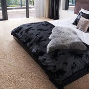 A carpeted bedrom